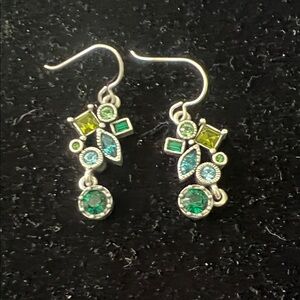 Earrings from Patricia Locke.